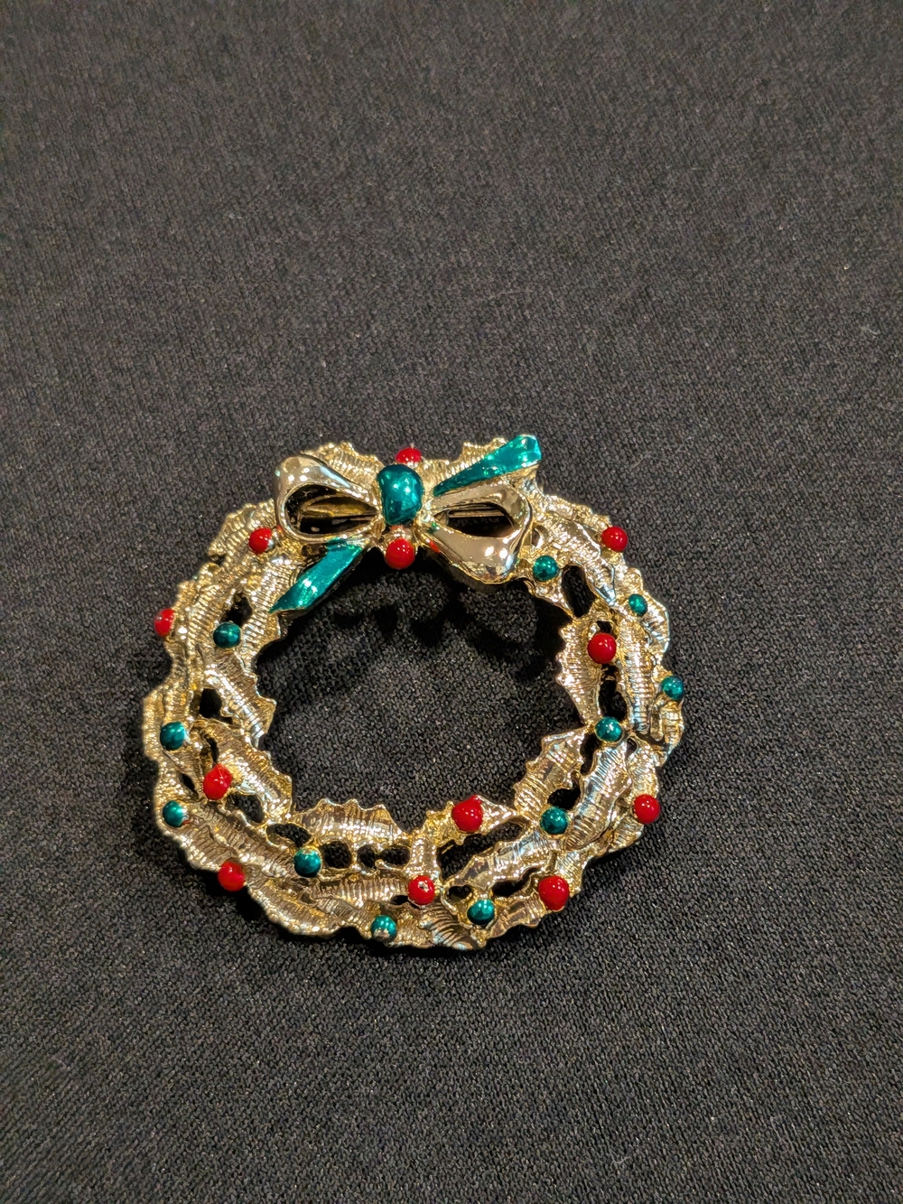 Gerry's Gold-Tone Holiday Wreath Brooch with Red and Teal Accents